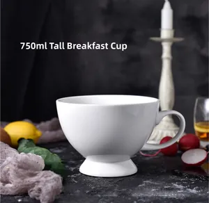 Detail of 750ml white ceramic footed breakfast cup with smooth glaze and large handle