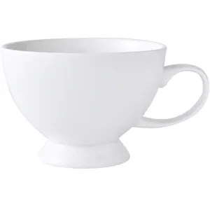 Elegant white ceramic mug with curved handle and footed base for breakfast cereal