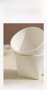 Close-up of polished white reinforced ceramic mug with a smooth scratch-resistant glaze