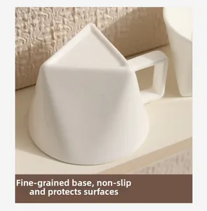 Detail of triangular ceramic cup showing the fine ground base for non-slip protection