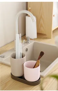 Detail view of macaron ceramic chopstick holder with tray and kitchen draining setup