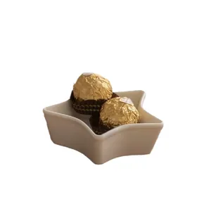 Star shaped white ceramic snack tray for desserts and small appetizers with smooth glaze