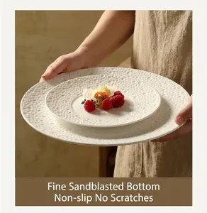 Detailed view of the fine frosted anti-slip base on a white embossed ceramic plate