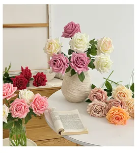 Detailed close-up of multi-color artificial roses in vases for home decor