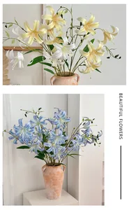 Detailed view of lifelike 3D lily artificial flowers in matte ceramic vases for decor