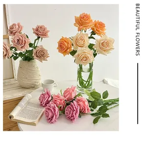 Close-up of realistic moisturizing silk roses in diverse colors for home decor