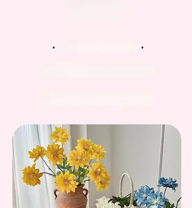 Detailed view of two-headed artificial dahlia flowers in elegant ceramic vase and basket