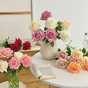 Artificial moisturizing roses in various colors placed in elegant vases for home decor