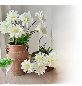 Realistic white dahlia silk flowers in a rustic terracotta vase for elegant home decor