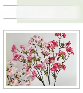 Close-up of pink artificial cherry blossom branches with multi-layered silk petals