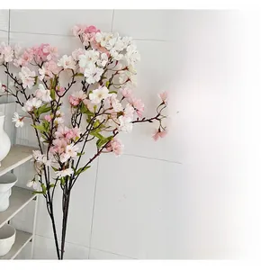 Detailed close-up of white and pink cherry blossom petals with natural brown stems