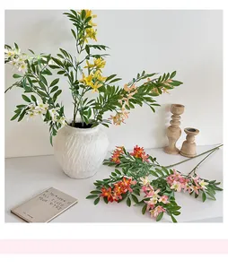 Macro detail of lifelike jasmine artificial flowers in a white vase for home decor