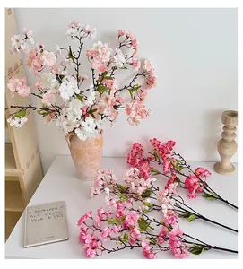 Close-up of artificial cherry blossom silk petals and realistic stamens in pink and white