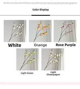 Detail view of artificial Vanda orchid stems in white, orange, purple, green, and champagne