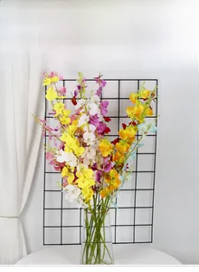 Artistic arrangement of colorful dancing lady orchids in a clear glass vase for home decor
