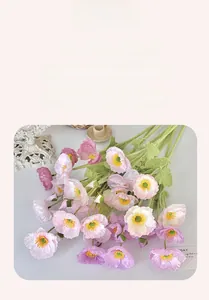 Detailed view of artificial poppy flowers with soft silk petals and textured green stems