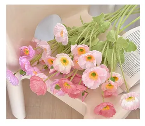 Close-up of realistic artificial poppy petals with natural texture and flocked green stems