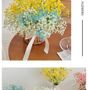 Detail of colorful artificial gypsophila bouquets in woven baskets with silk ribbons