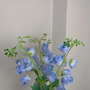 Macro view of artificial blue bellflower silk petals with natural purple gradient stems