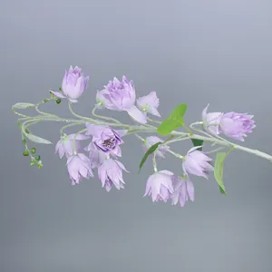 Detail of lavender silk lily of the valley with realistic flocked stems and small green buds