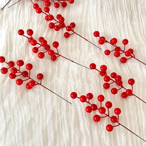 Artificial red holly berry stems for festive home decor and floral arrangements