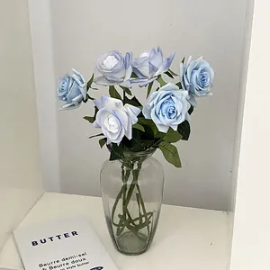 Realistic artificial blue-purple rose bouquet in transparent glass vase for home decor