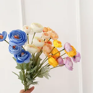 Handheld bouquet of colorful artificial silk Ranunculus flowers for home decor
