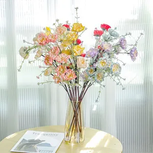 Detailed view of colorful artificial poppy flowers with natural textures in glass vase