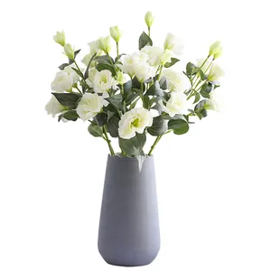 Realistic 4-head white Eustoma artificial flower arrangement in a grey textured vase
