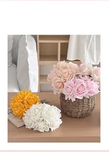 Detail of assorted faux moisturizing roses in white, yellow, and champagne hues