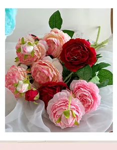 Detailed view of high-quality silk rose bouquet with realistic petals and green leaves