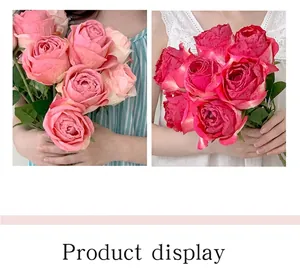 Detail showing artificial curled roses in light pink and magenta for home decor