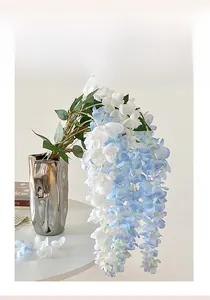 Close-up of hanging wisteria flowers in light blue and white for ceiling decoration