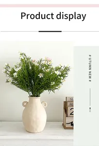 Detail of artificial daisy bouquet in a vintage ceramic vase for home decor