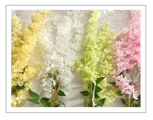 Detail view of multicolored artificial wisteria hanging flowers for wedding decoration