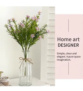 Detail of purple artificial babys breath flowers in a glass vase with rustic twine decoration
