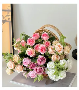Detailed view of artificial multi-colored roses and berries in a woven basket