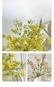 Detail of colorful artificial gypsophila flowers in a white ceramic vase for home decor