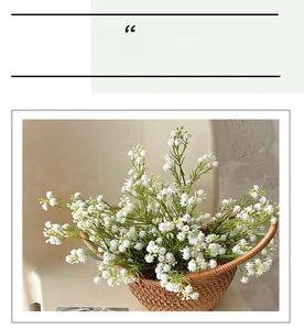 Close-up of white artificial gypsophila flowers in a rustic brown woven wicker basket