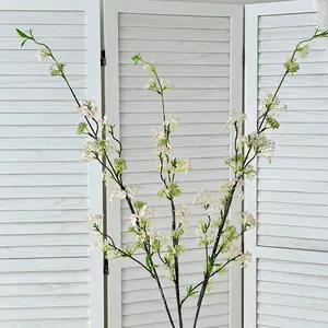 Faux white snow willow flower branches for elegant living room decor and floral arrangements