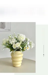 Modern wavy cream ceramic vase with artificial white roses and daisies for home decor