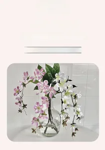 Close-up of artificial jasmine flowers in a glass vase for home interior decoration