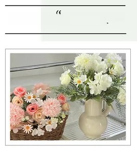 Detail of pink roses, white pompom mums and daisies in a ceramic vase and woven basket