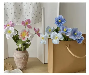 Detailed close-up of colorful artificial tulip petals with delicate texture and realistic stamens