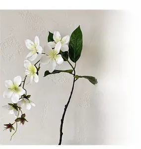 Close-up of 3D printed white jasmine flowers with realistic petals and green buds