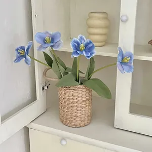 Artificial blue tulips in woven basket for home decor and wedding floral arrangements