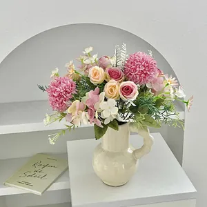 Artificial rose and hydrangea bouquet in a wavy ceramic vase for home decoration