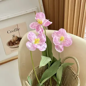 Artificial pink brownie tulips in a woven basket for home and wedding table decor
