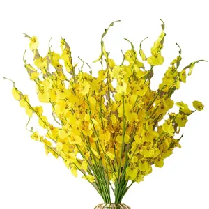 Realistic yellow artificial Oncidium dancing lady orchid bouquet in golden vase