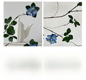 Detail of artificial blue apricot flowers with delicate yellow stamens and green leaves